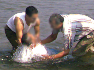 Imagen pixelada del bautismo / History Maker